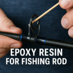 Epoxy resin being applied to a carbon fiber fishing rod blank for strength and gloss finish